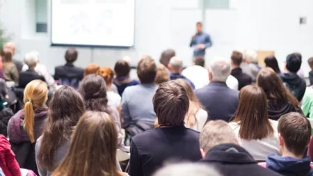 man presenting in front of audience