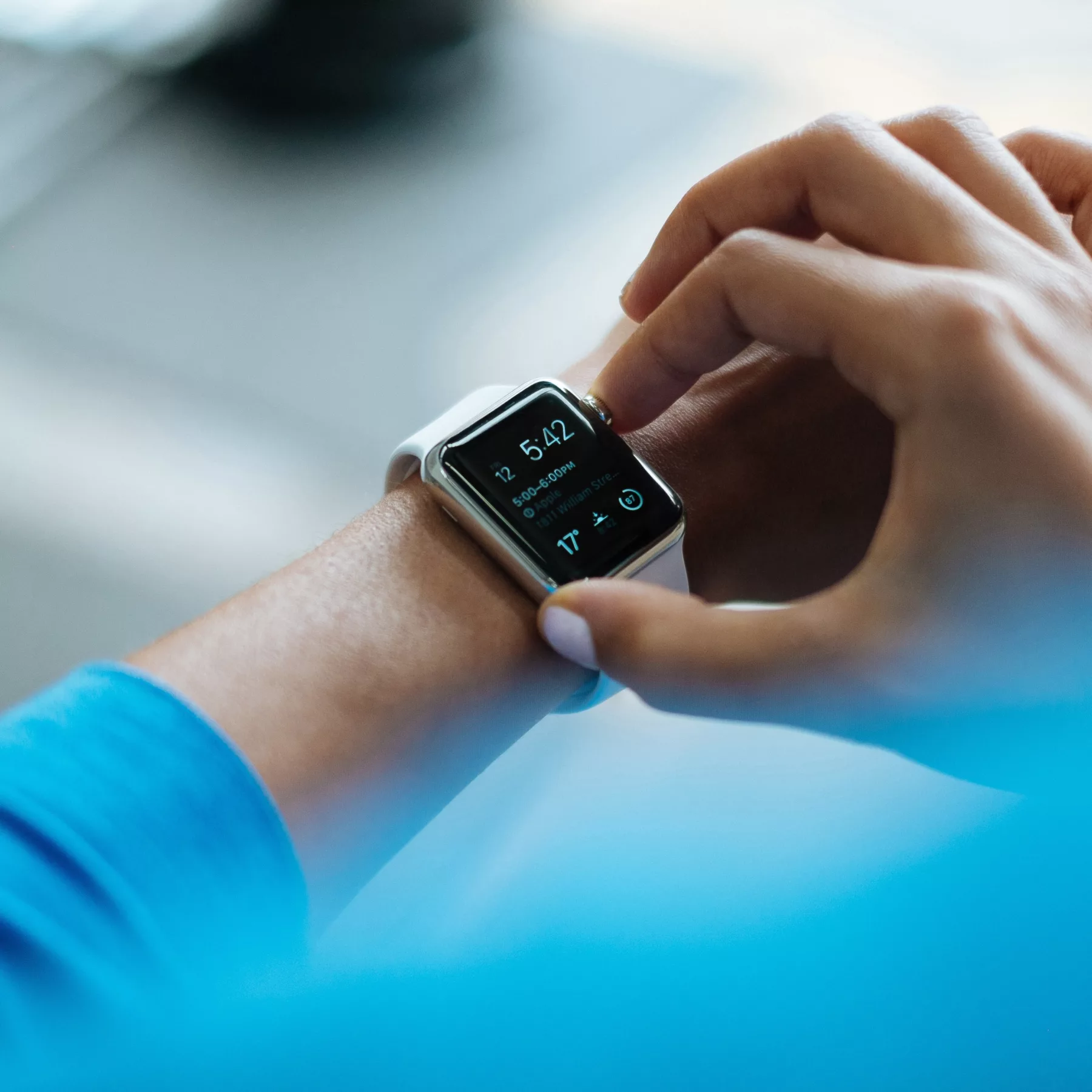 person looking at their smart watch screen
