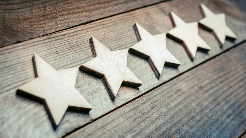5 star review on wooden board