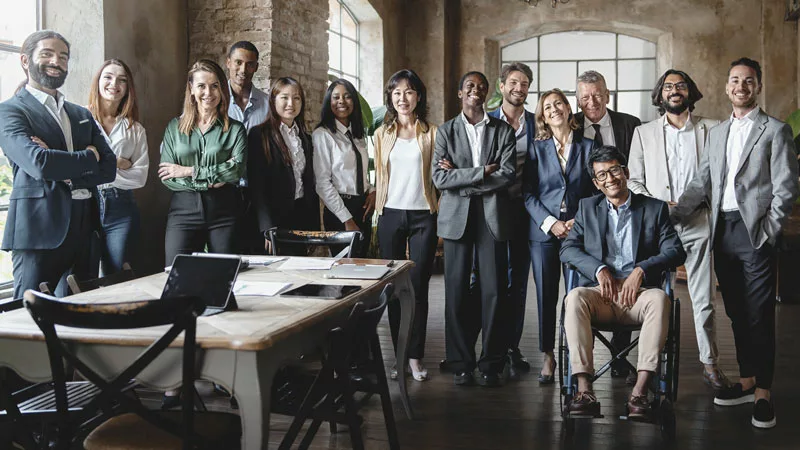 inclusive work team posing for photo