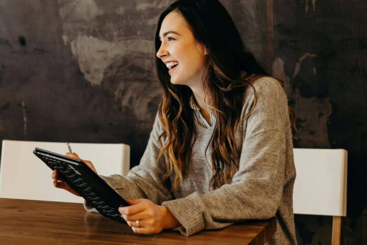 hr manager sitting at table with notebook