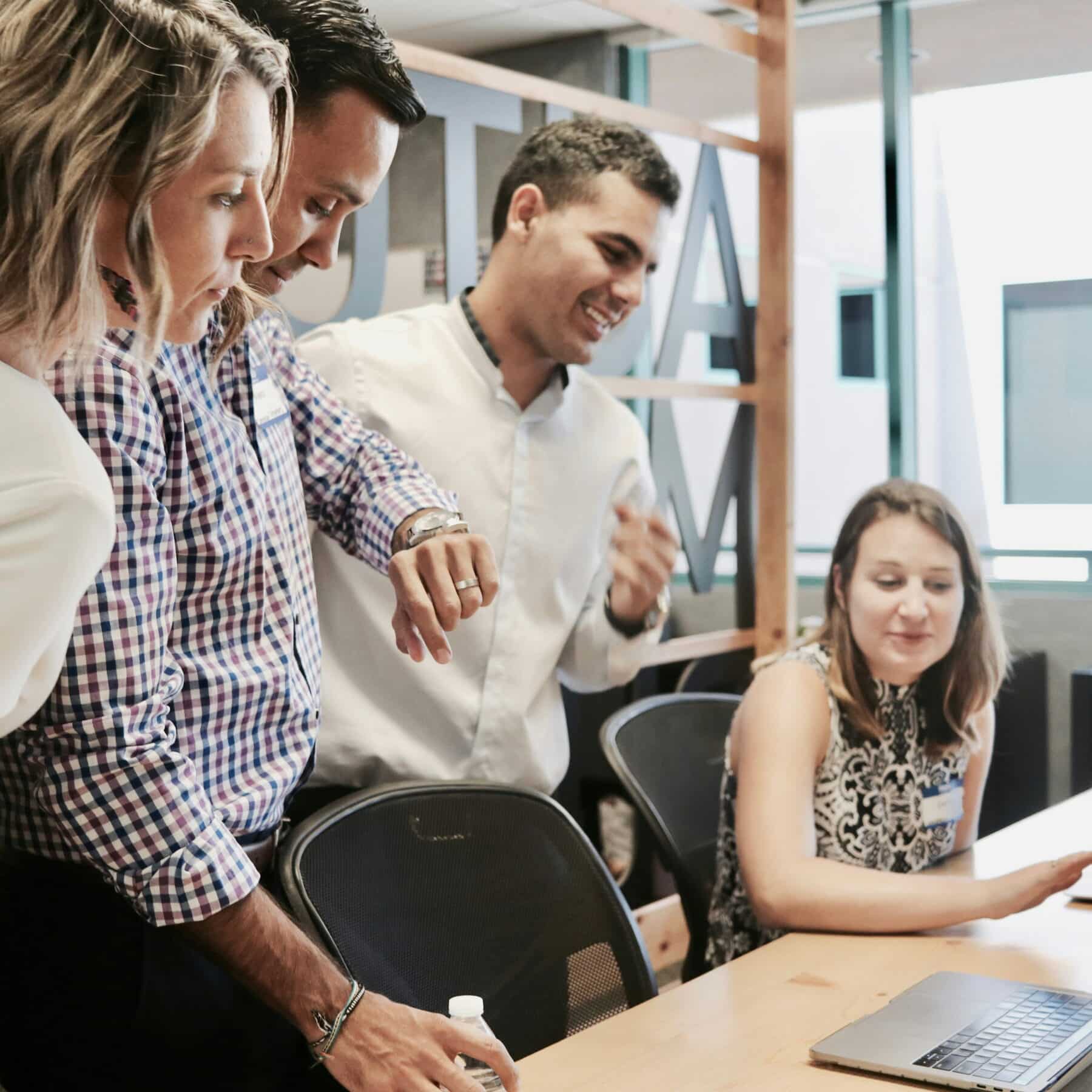 office workers discussing benefits programs