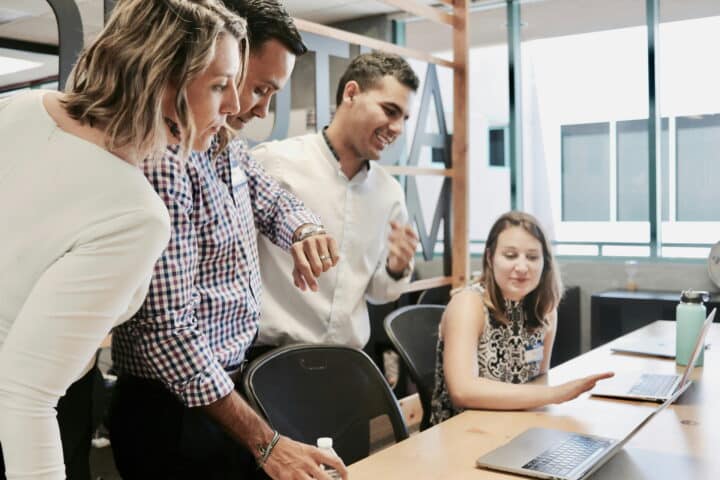 office workers discussing benefits programs
