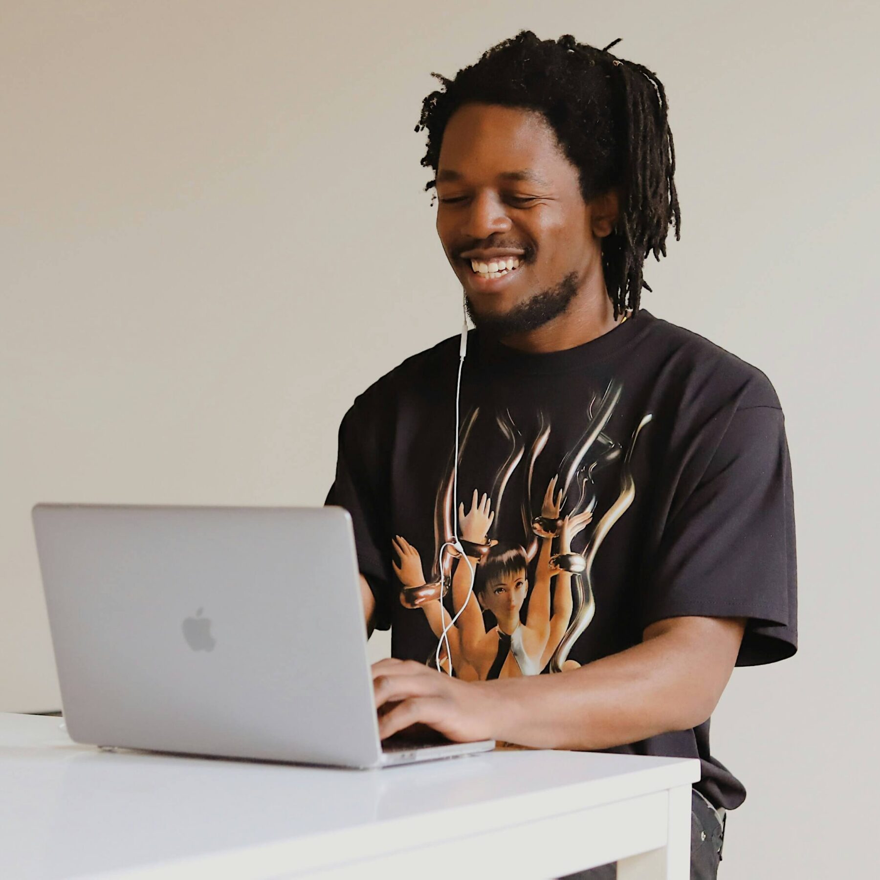 man using laptop at standing desk