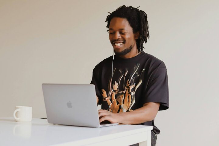 man using laptop at standing desk