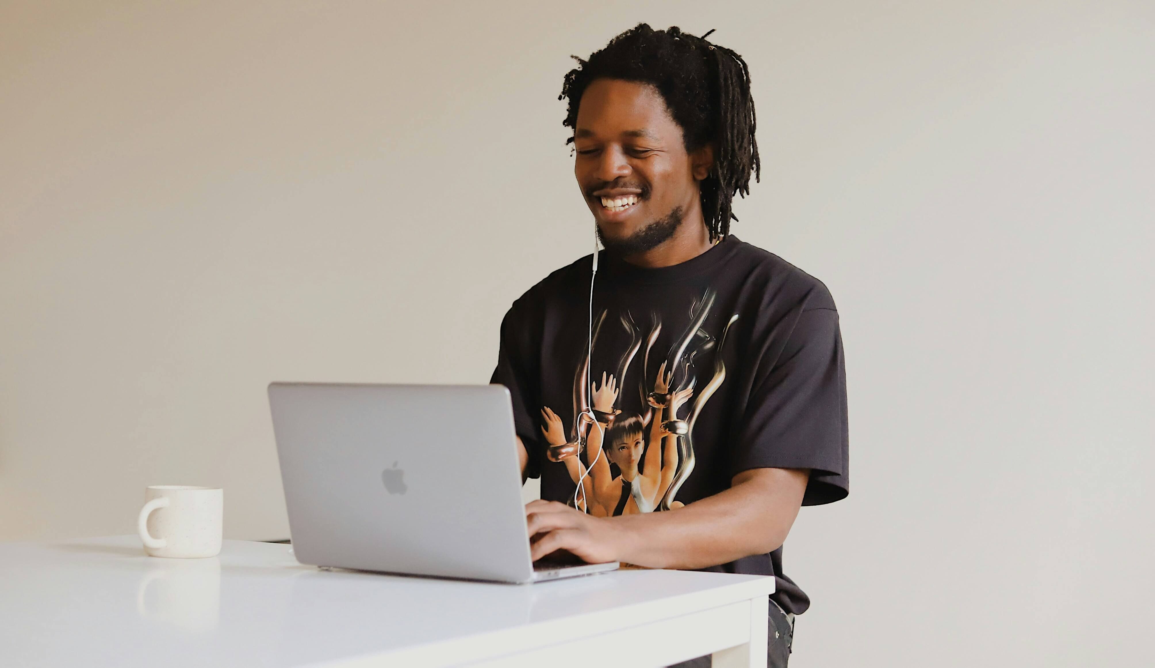 man using laptop at standing desk
